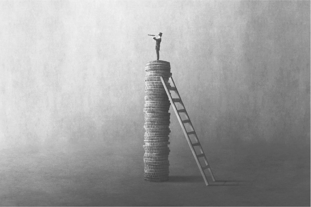 Person standing on stacked coins representing wealth management growth